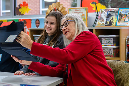 A grandmother and her grandchild using an iPad. Links to Gifts by Estate Note A grandmother and her grandchild using an iPad. Links to Gifts by Estate Note