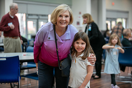 An older woman with a child smiling for a photo. Links to Gifts by Will will.jpg