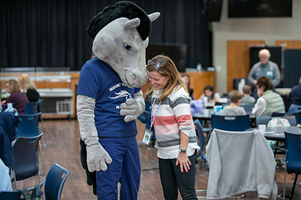 A woman with The Mount Vernon School mascot. Links to Beneficiary Designations A woman with The Mount Vernon School mascot. Links to Beneficiary Designations